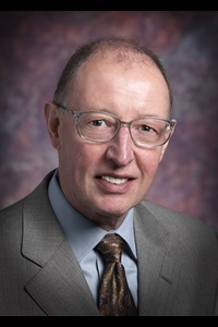 A headshot of Ron Rohrer, a member of the Lyle School of Engineering Faculty.