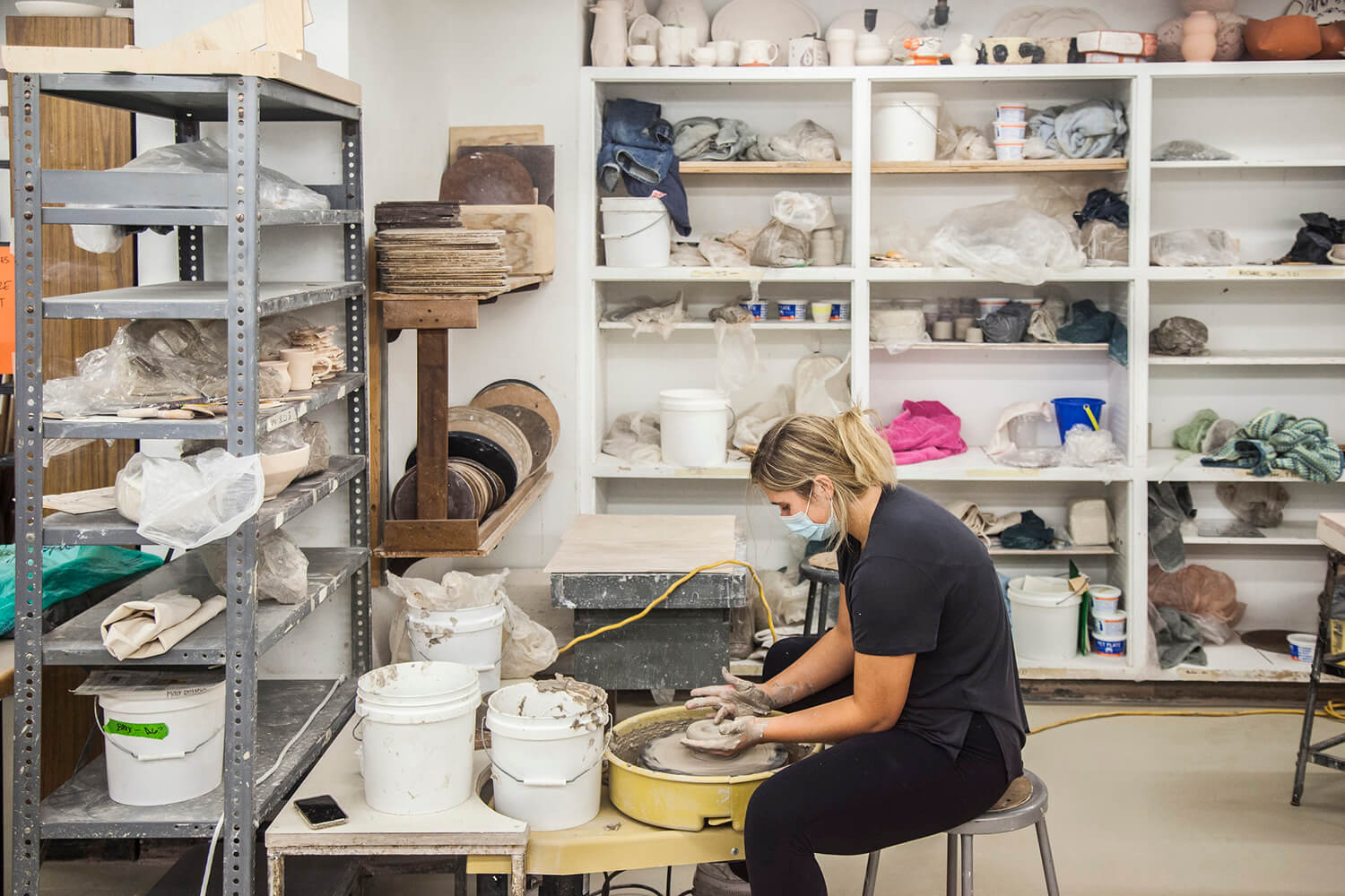 woman making ceramics in an art studio
