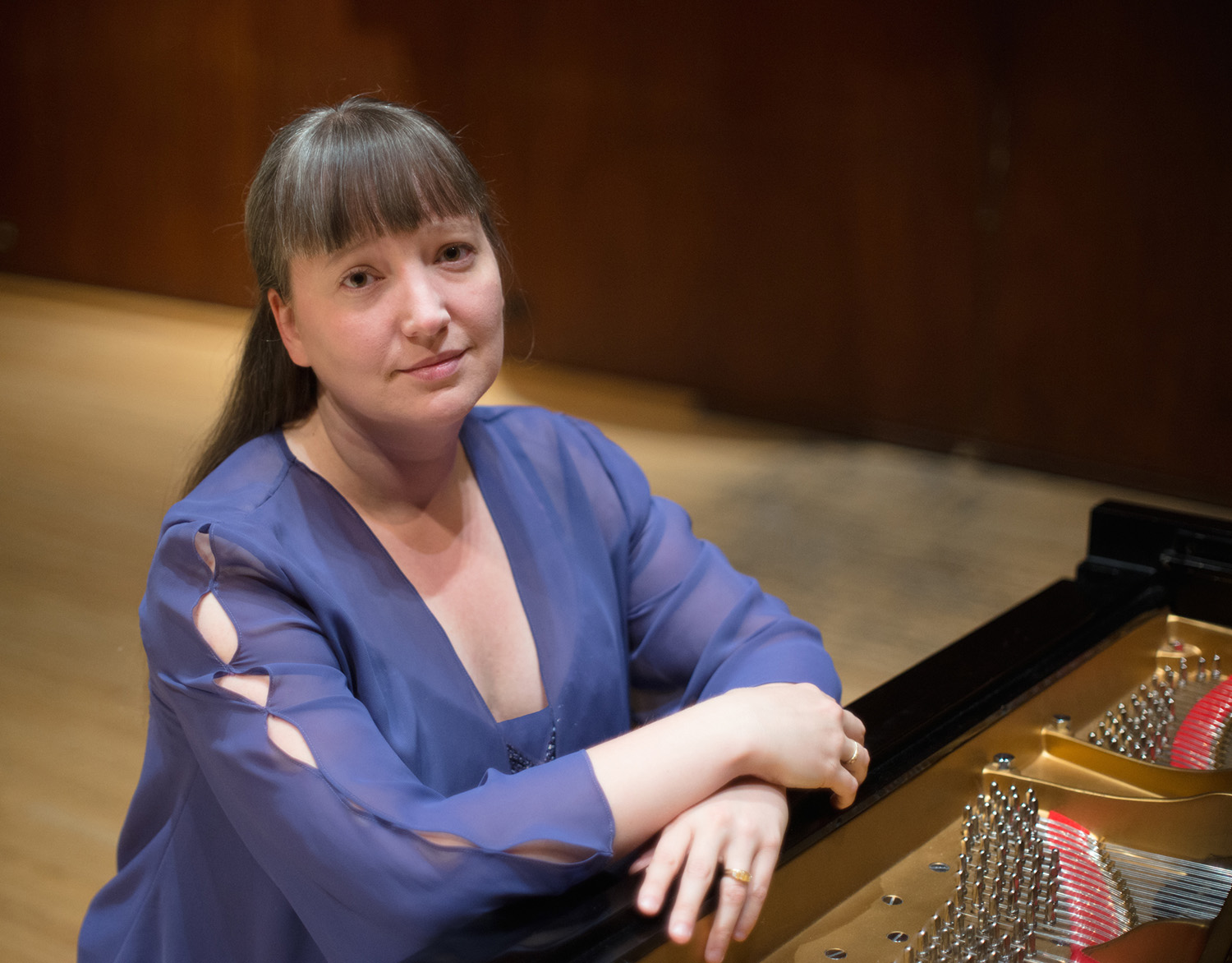Liudmila Georgievskaya sits at the piano