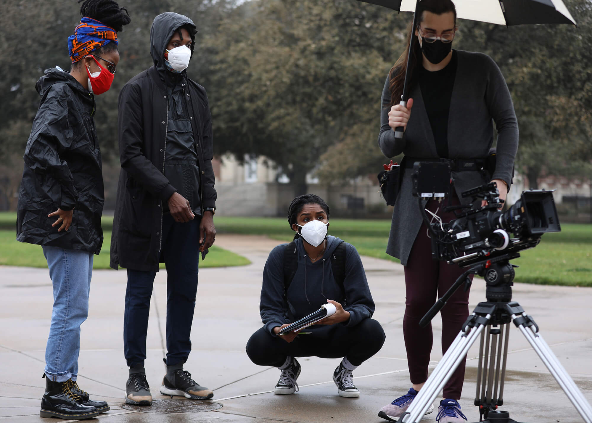 students filming behind the scenes