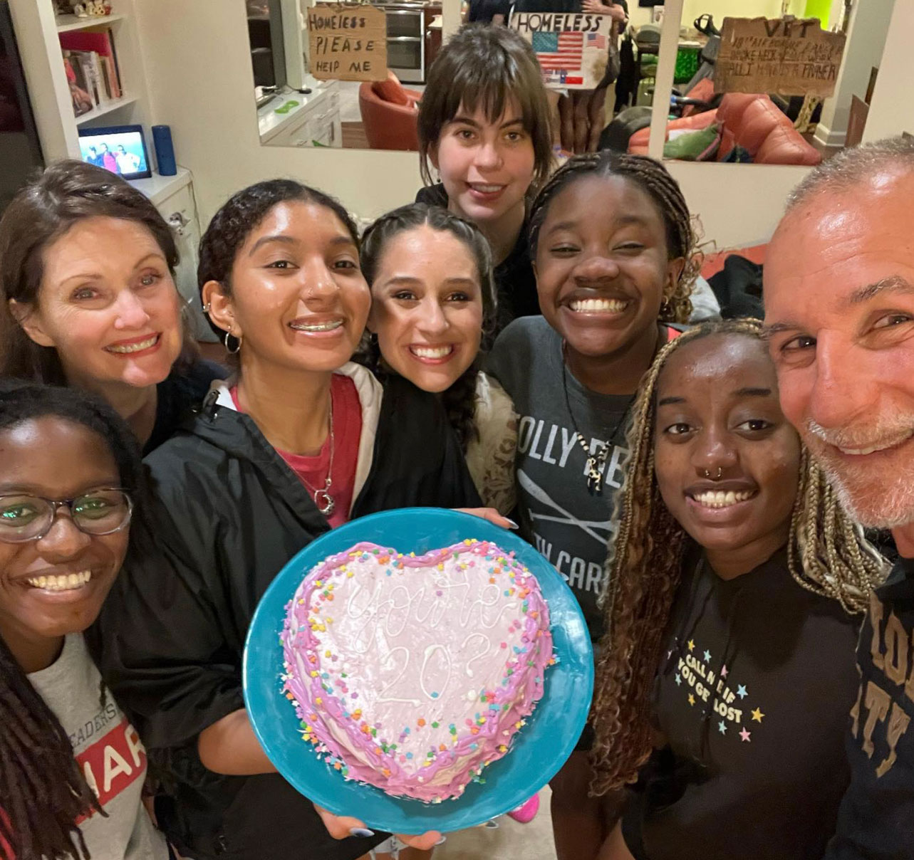 Armstrong Commons students celebrate with cake and their Faculty-in-Residence, Willie Baronet.