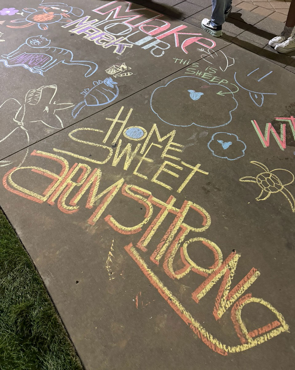Sidewalk chalk art celebrating life at Armstrong Commons.