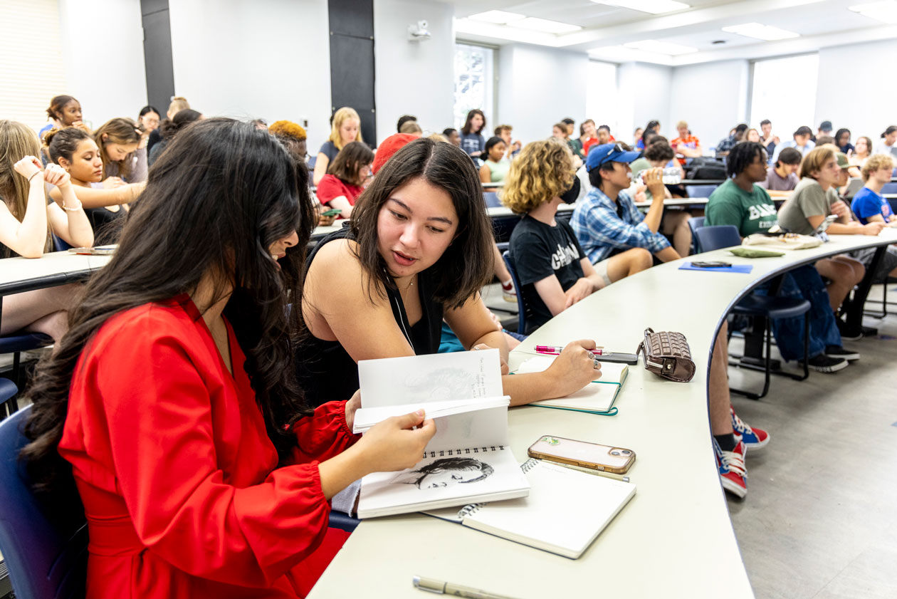 Two students collaborate in the First-Year Arts Community Experience class.