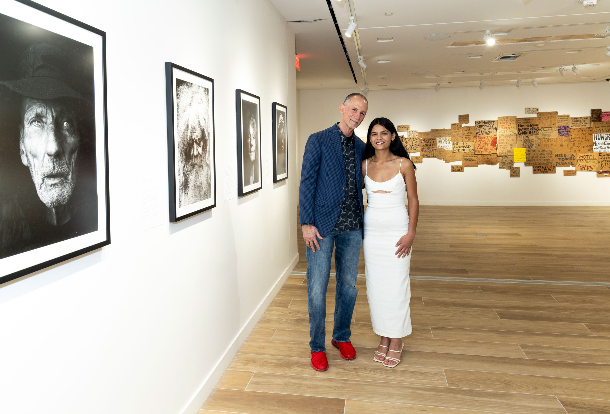 Artists Willie Baronet and Leah den Bok pose in the gallery of their exhibition.