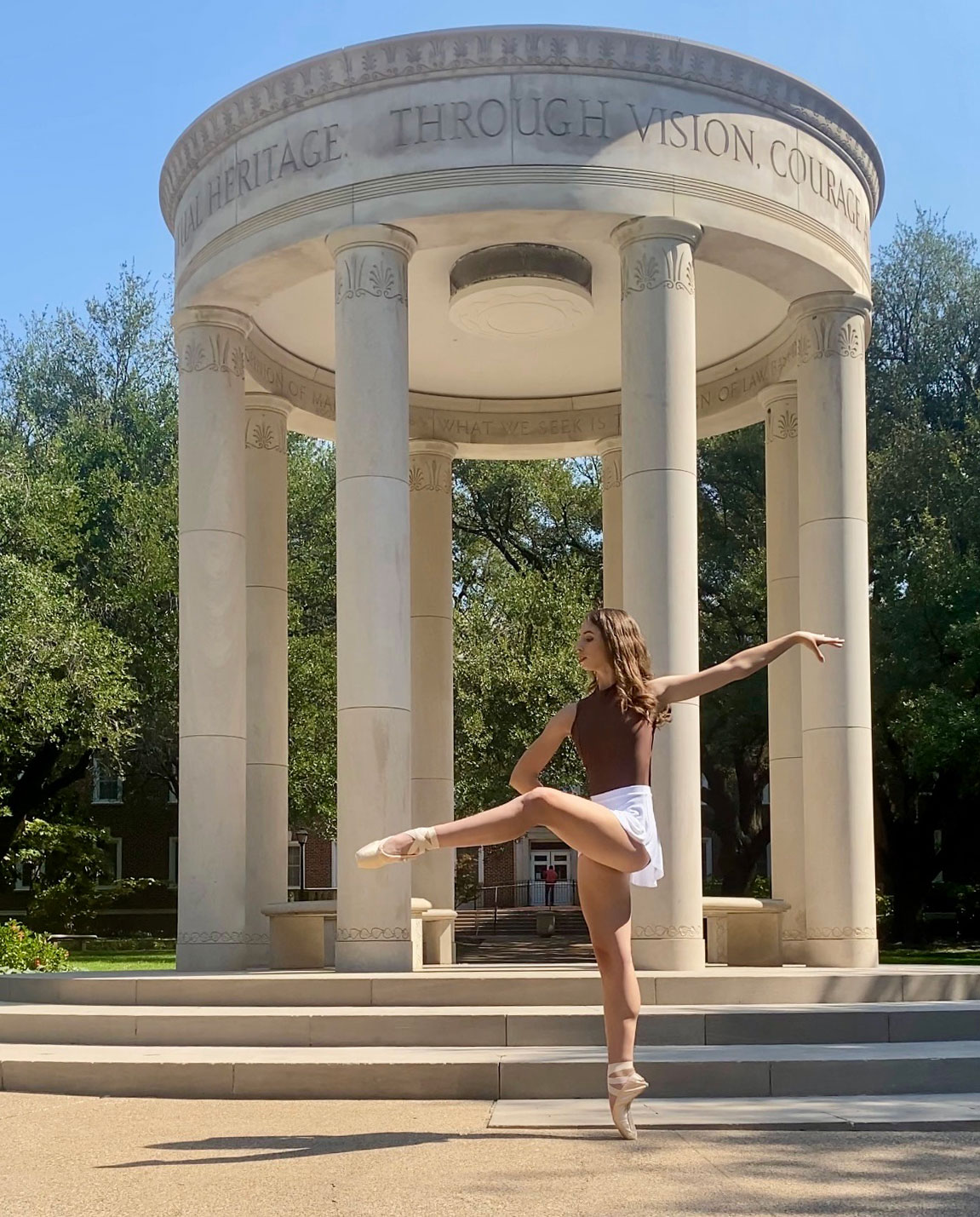 Dance and statistical science double major Anne Hulme performs a ballet piece on campus.