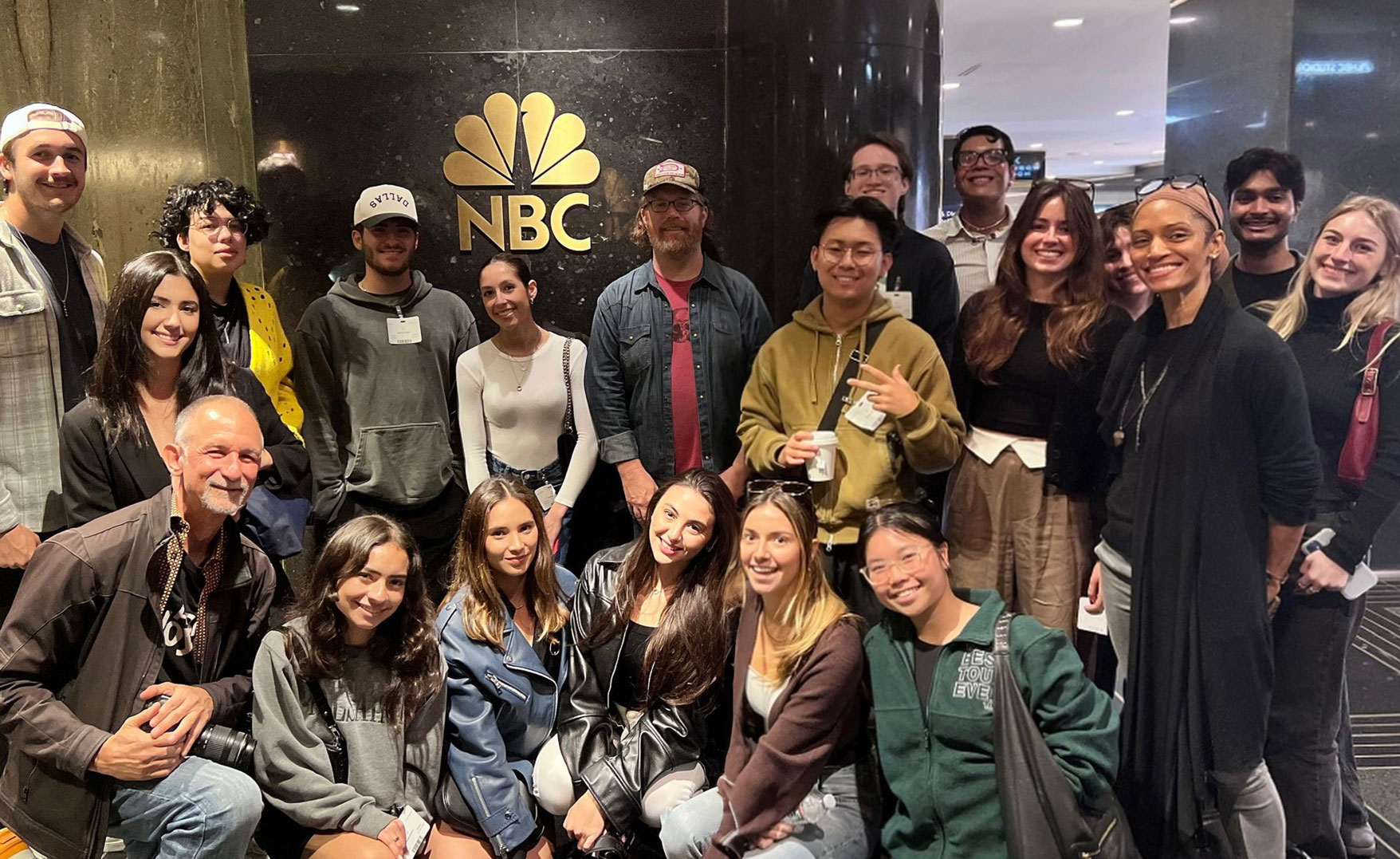 Advertising students pose during a behind-the-scenes tour of NBCUniversal in NYC