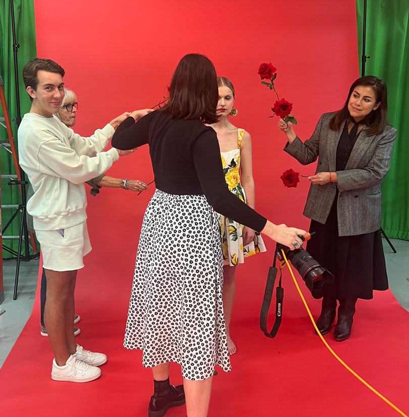 Fashion Media student Tyler Martin assists on the set of a editorial fashion feature shoot.