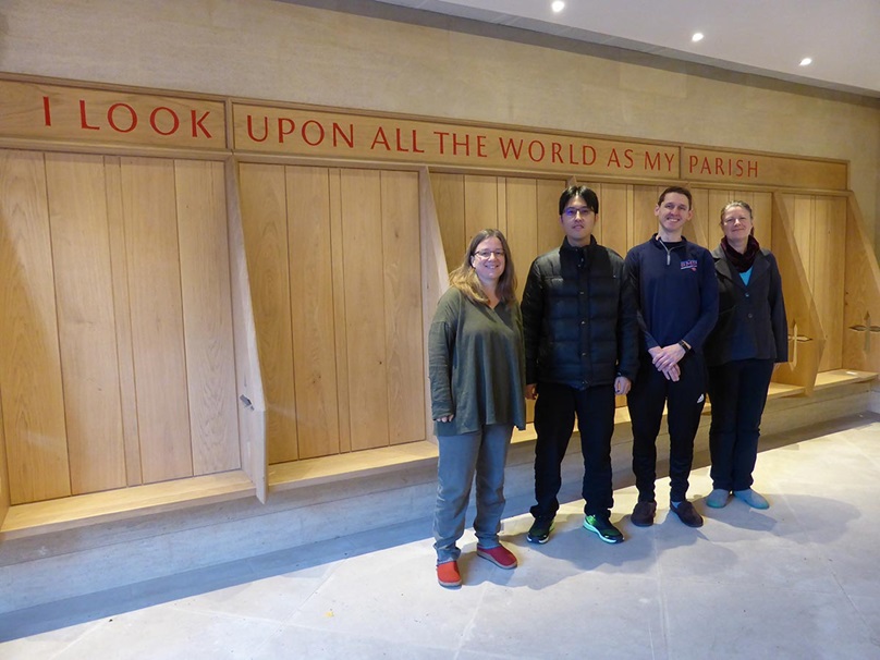 Wesley House Principal Jane Leach (left) and Director of Studies Rev. Carole Irwin (far right) join Perkins alums Adam White (M.Div. ’15) and Shuo En Liang (M.T.S. ’17), pictured at the college’s main gatehouse entrance.