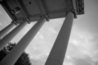 Black and white photo looking up at the columns outside Perkins Chapel