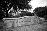black and white photo of the Joe & Lois Perkins School of Theology sign outside of Kirby Hall