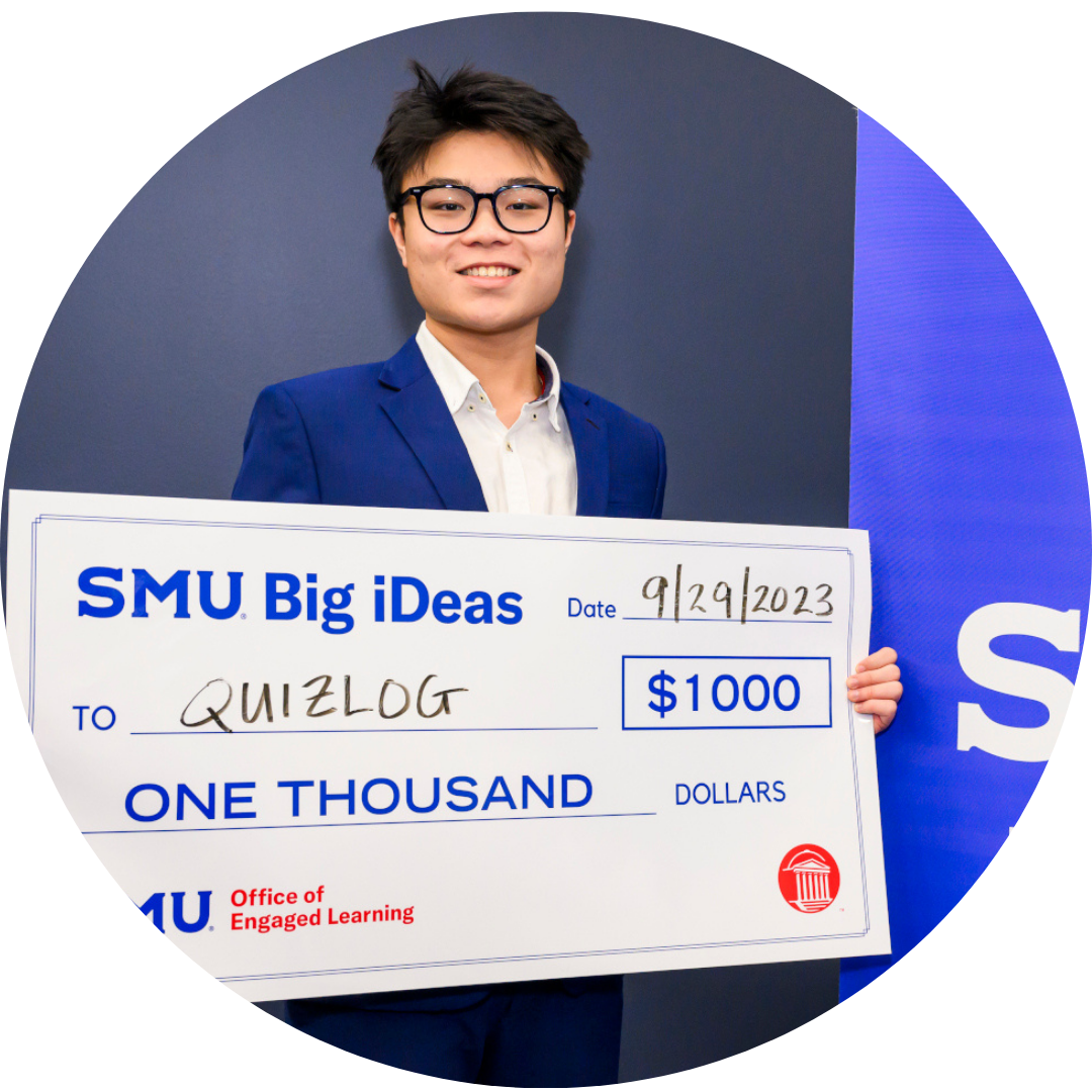 Eric Vu, founder of Quizlog, with big check from Big iDeas