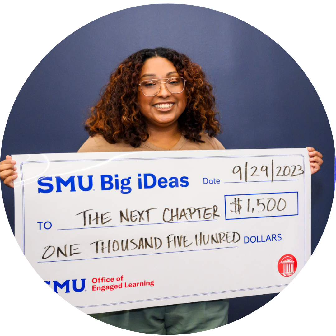 Tiffany Jones, founder of the Next Chapter, with big check from Big iDeas
