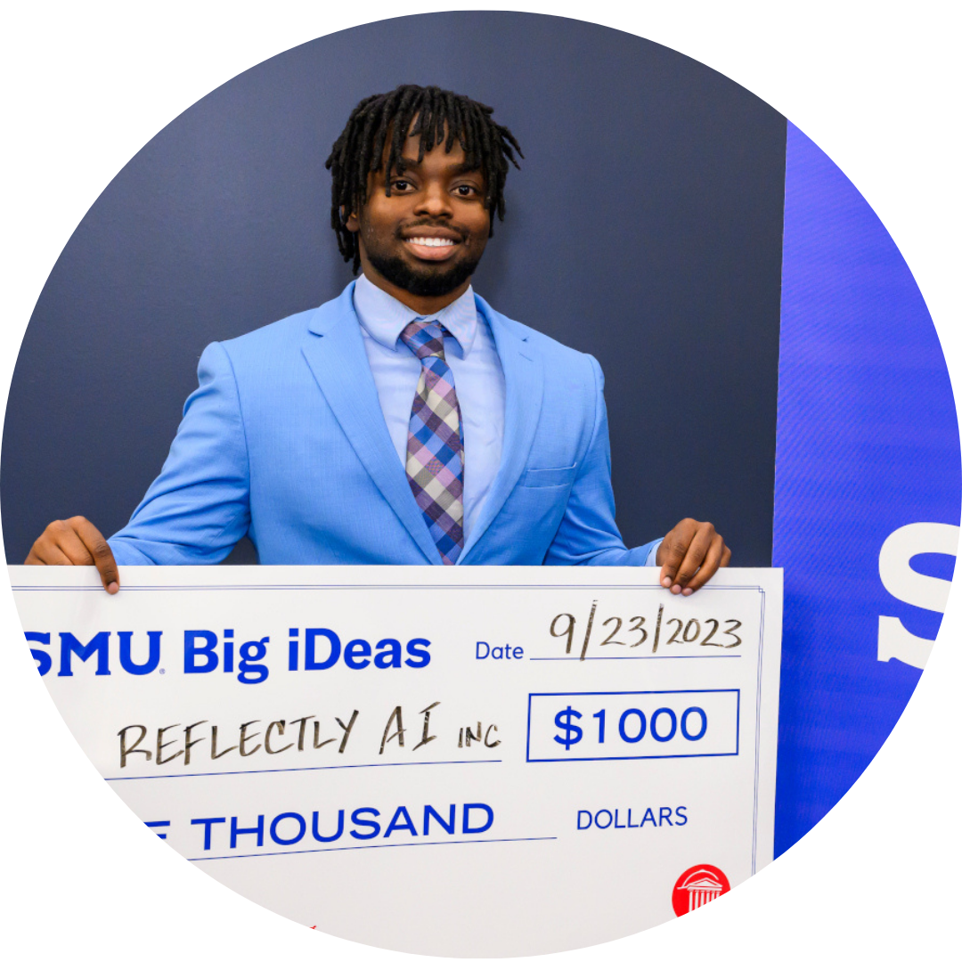 Trevor Gicheru, founder of Reflectly AI, with big check from Big iDeas