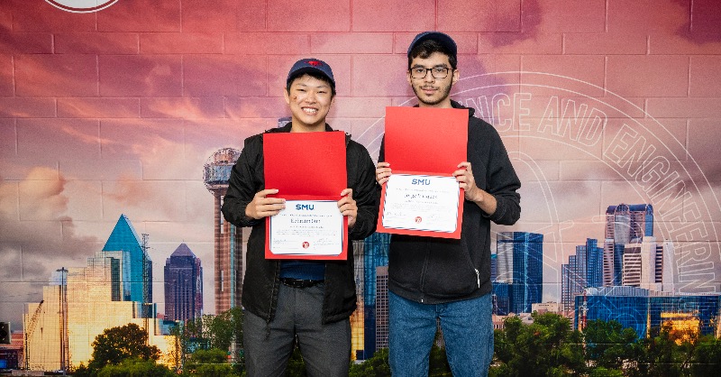 Students Ephraim and Jorge posing with Mustang Scholar certificate