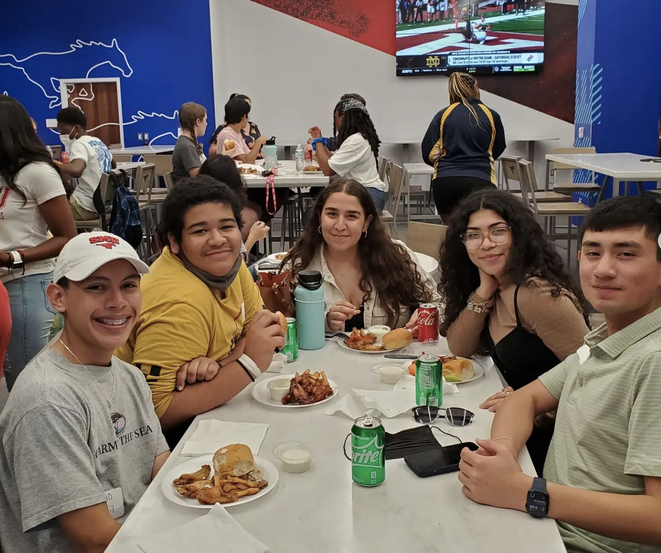 Group of students posing at a table