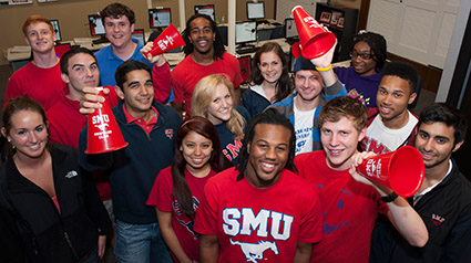 An assorted crowd, donning shirts in red and white featuring SMU Peruna mustang logo.