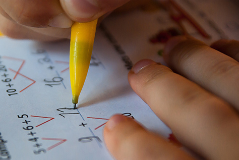 Close up image of student working on math problems
