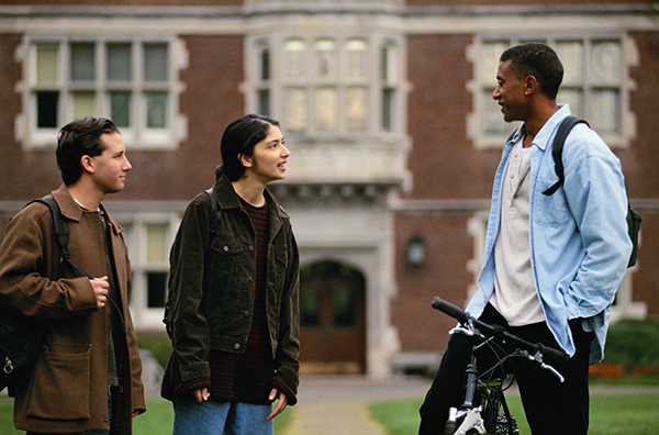 Students in discussion outdoors on campus