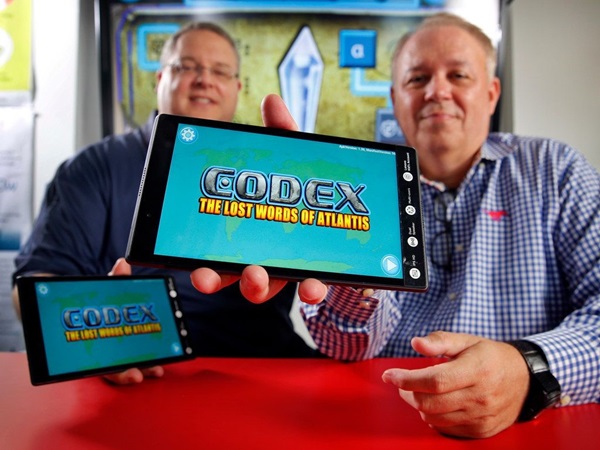 Dr. Corey Clark and Dr. Tony Cuevas show the Codex: Lost Words of Atlantix app on tablet.