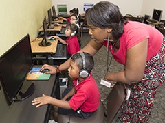 Research participants using a computer based assessment system for a research project on improving oral reading fluency in grades 2-4