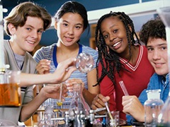 Students in lab with beakers