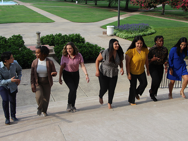 McNair Scholars walking up the stairs of SMU's Dallas Hall.
