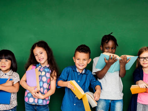 Group of school kids reading for education