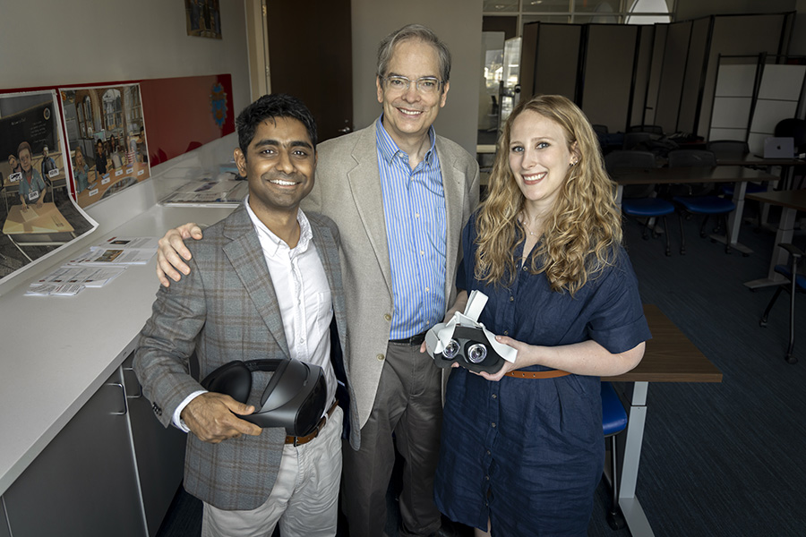 Professors Prajakt Pande, Kelsey Schenck, and Corey Brady standing in Mixed Realing lab with VR Equipment.