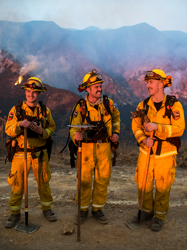A photo of three firefighters enjoying a break.