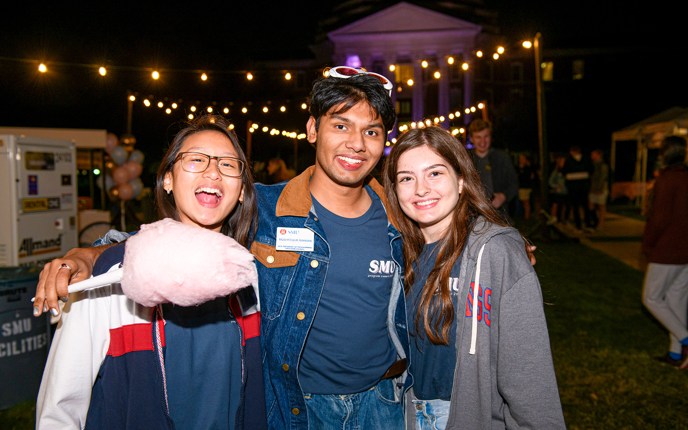Three SMU students at Midnight Market event