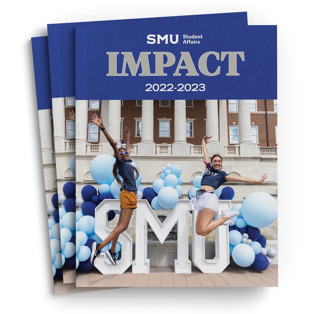 2022-2023 Student Affairs Impact Cover, two students jumping infront of white SMU letters with dark and light blue balloons, grey block letters on blue background