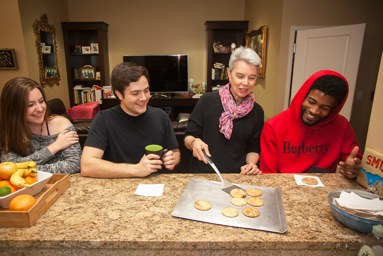 students having cookies with the FiR in the FiR apartment