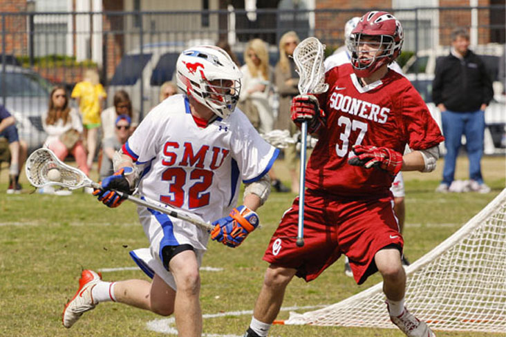 A photo of two opposing lacrosse players during an intramural game.