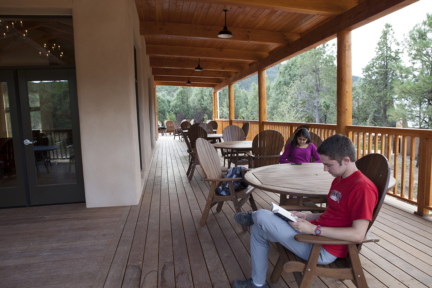 Students study on the Miller Center deck at SMU-in-Taos.