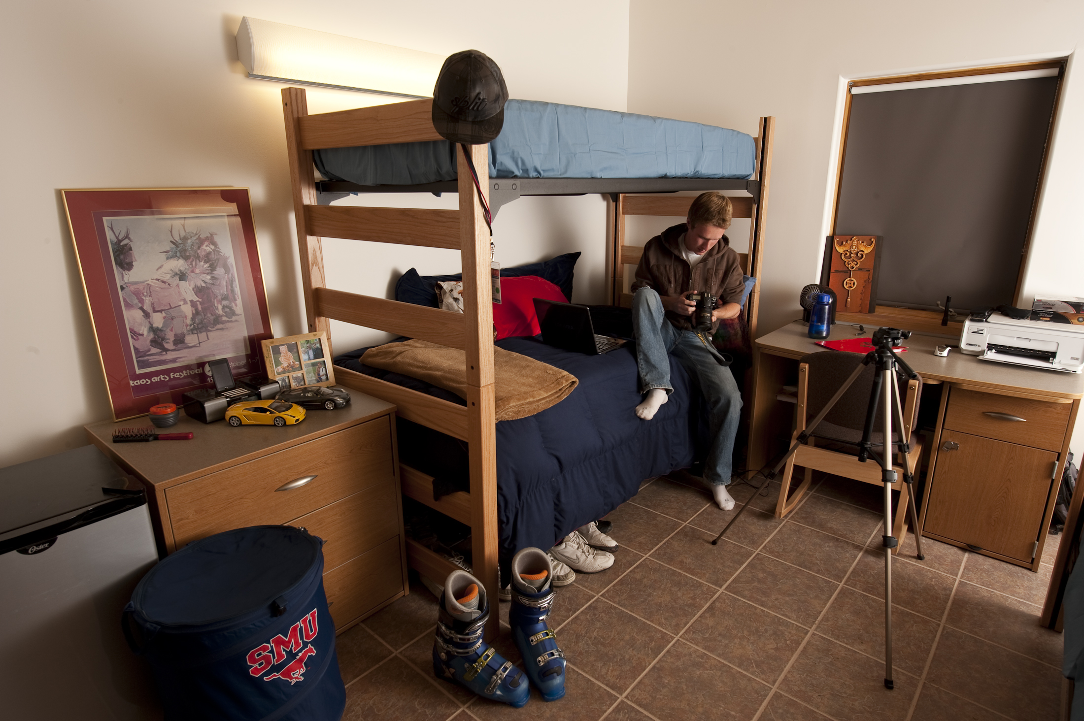 A student relaxes in an SMU-in-Taos room.