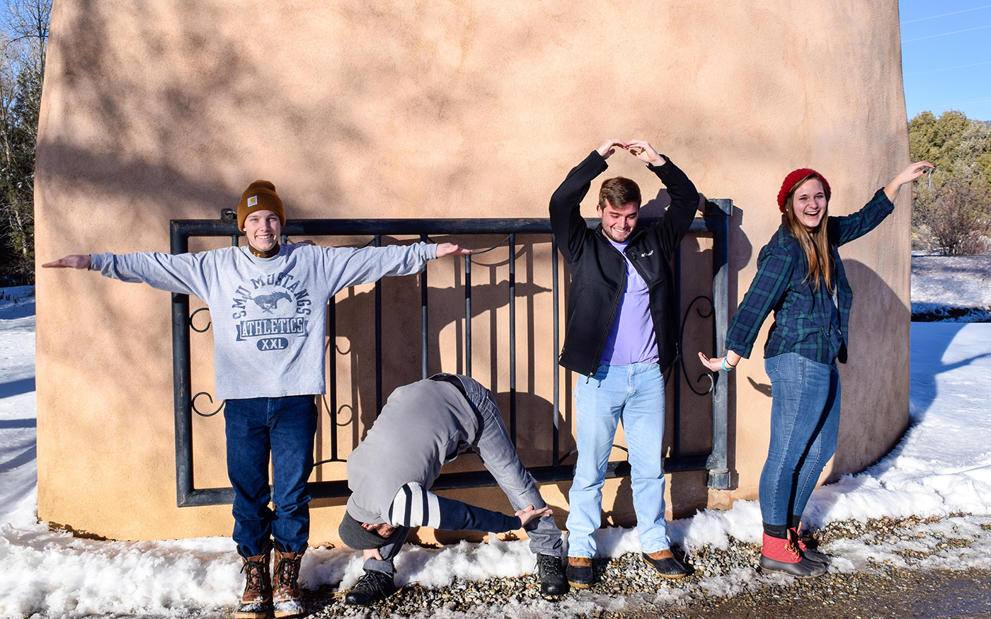 Four SMU-in-Taos students spell out TAOS with their bodies