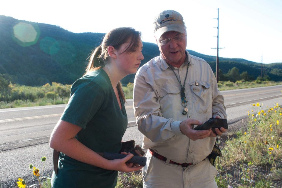 An SMU-in-Taos professor teaches a student near the highway.