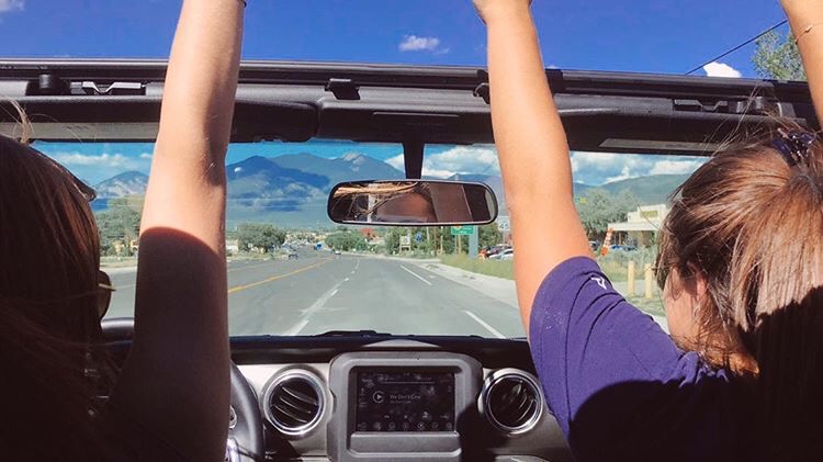 Students drive in a convertible to SMU-in-Taos 