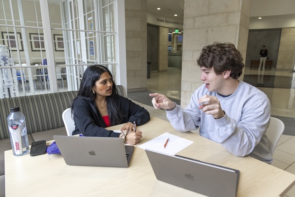 SMU Lyle students study in a common area in Caruth Hall