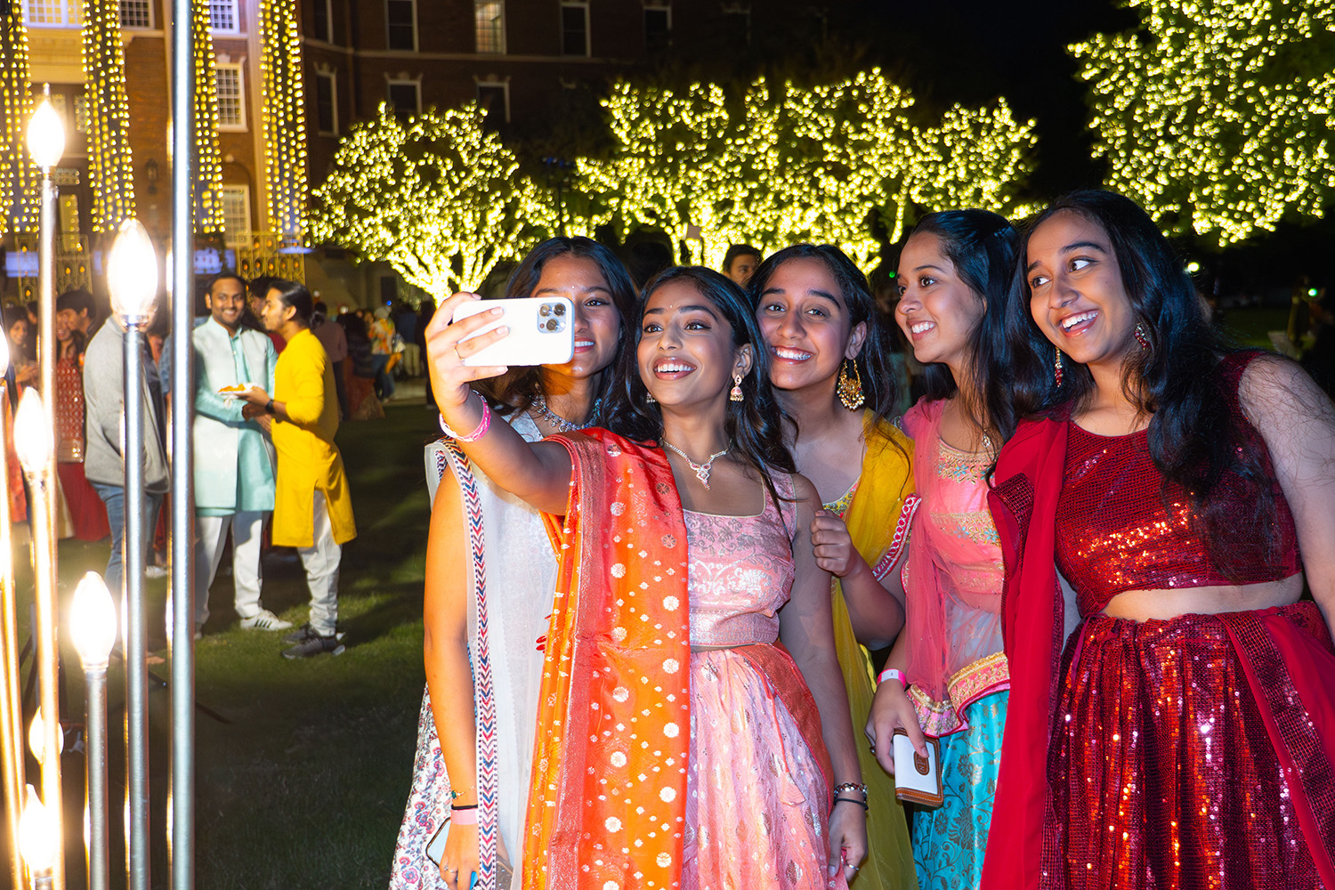 Students pose for a selfie at the Diwali festival.