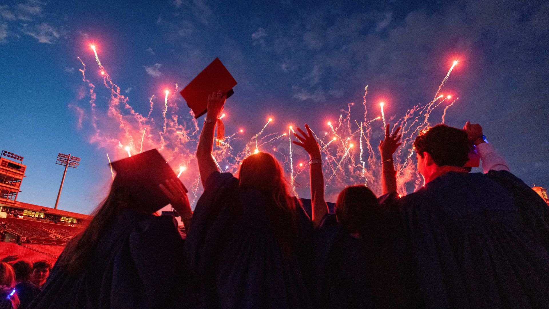 SMU graduates looking at fireworks
