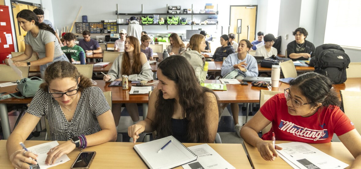 Students chat during a group assignment for class at SMU Lyle