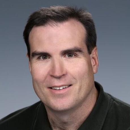 A portrait headshot of David Reed