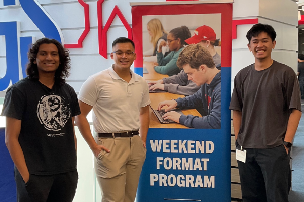 Weekend Format Students smile and pose before class at SMU Lyle in Dallas Texas