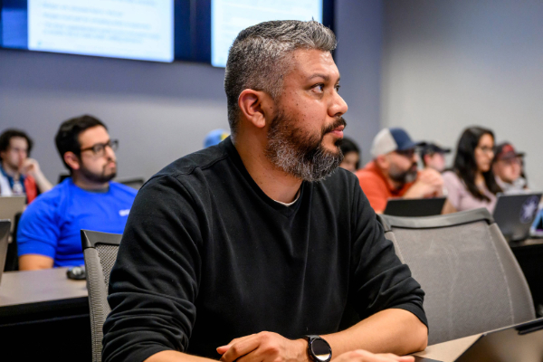 A student in class at SMU Lyle School of Engineeirng looking engaged during a lecture