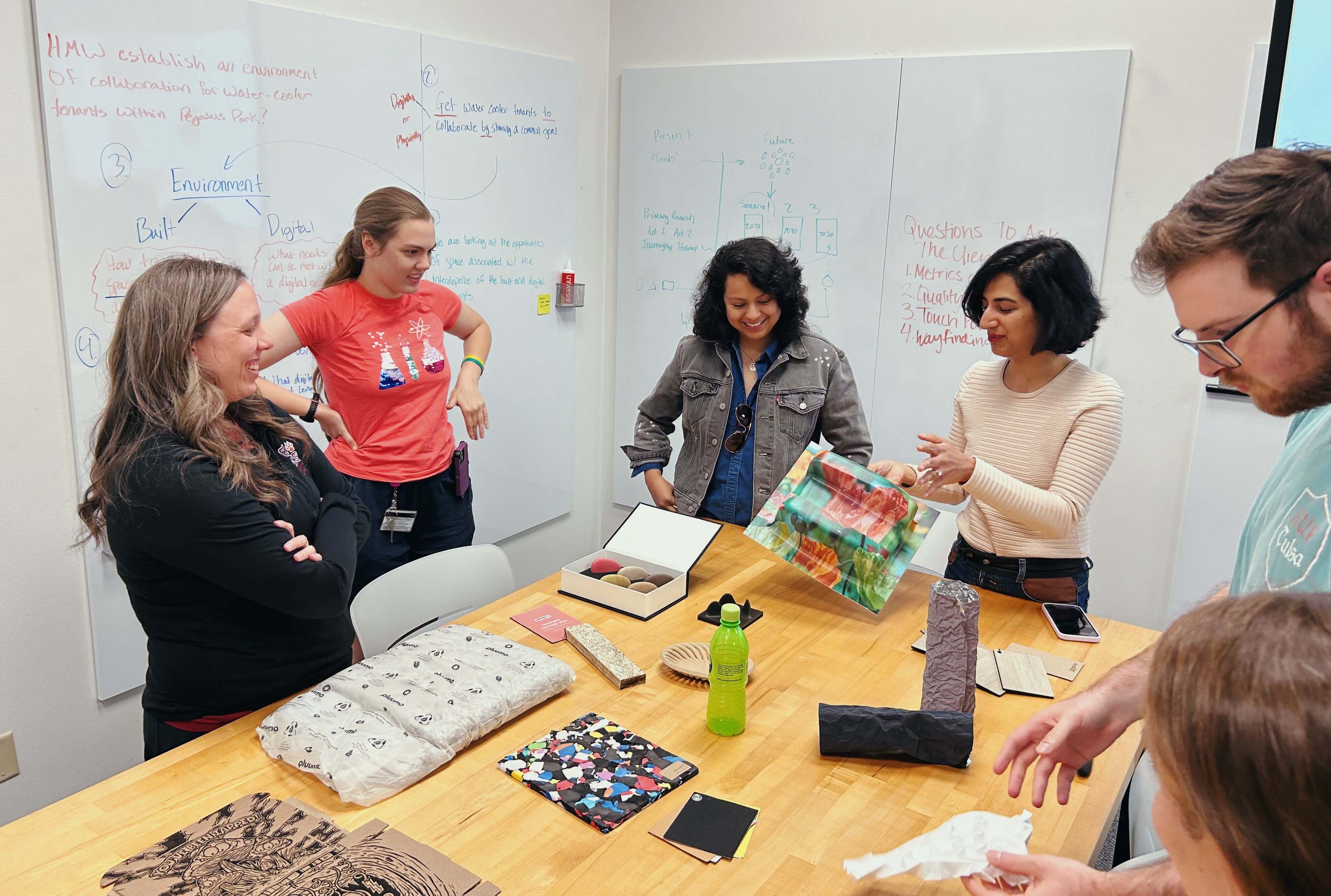 Group discussing design ideas around a table 