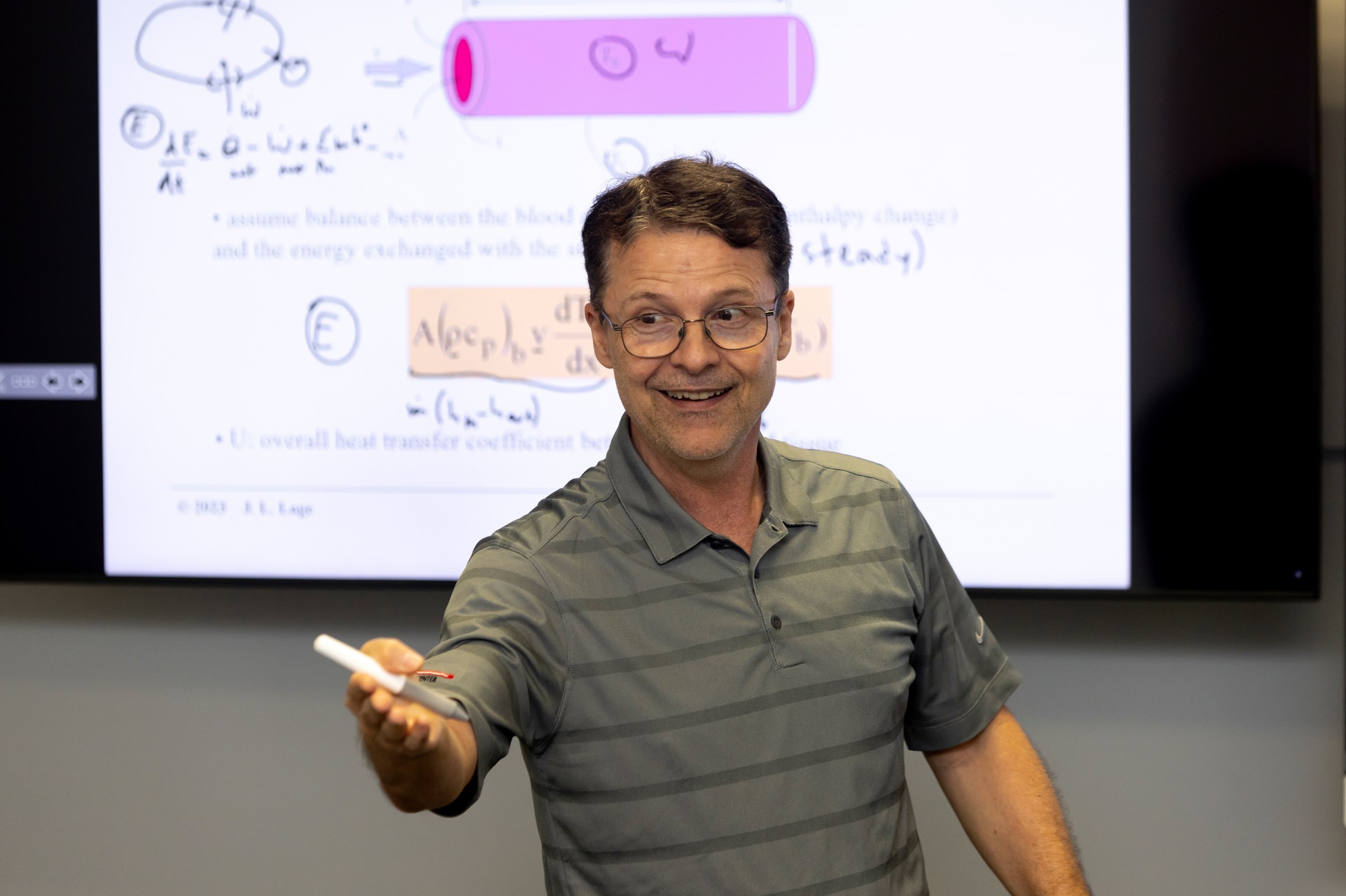 Caruth 184 Male Professor Teaching with Screens in Background