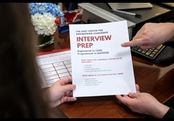 Student reviewing interview preparation checklist at SMU.