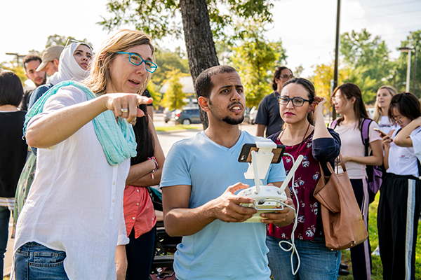 man and women working outside