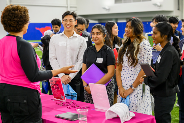 Students talk with a recruiter at the SMU all majors career fair